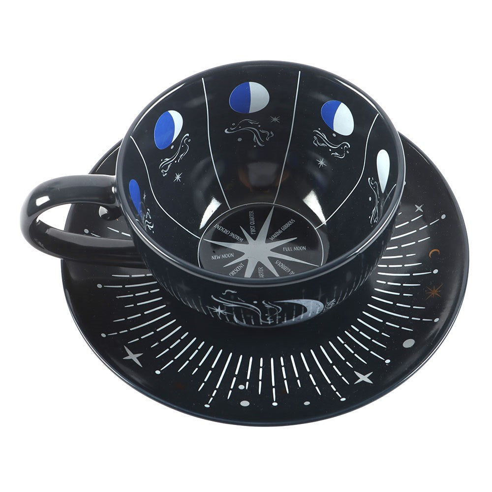 Mėlynojo mėnulio fazės arbatos puodelis ir lėkštutė